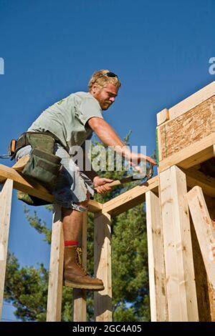 Framing carpenter works on new homes